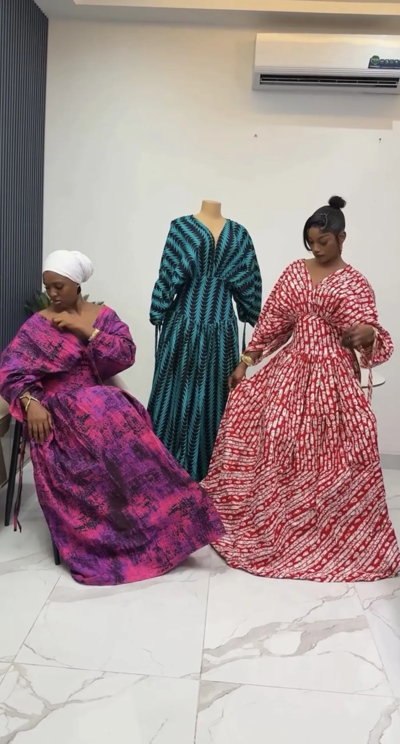 Three gowns in plum ombré, emerald feather and crimson batik